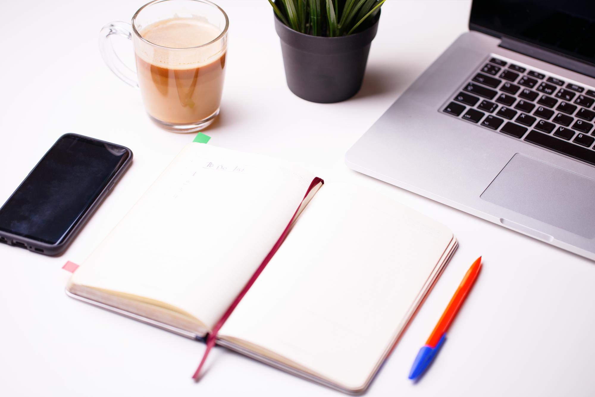 Workspace with laptop and finance notes
